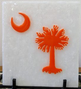 Palmetto & Crescent (white/orange), stained glass, resin, glass chips. approx. 6.25" w x 7" h - $40