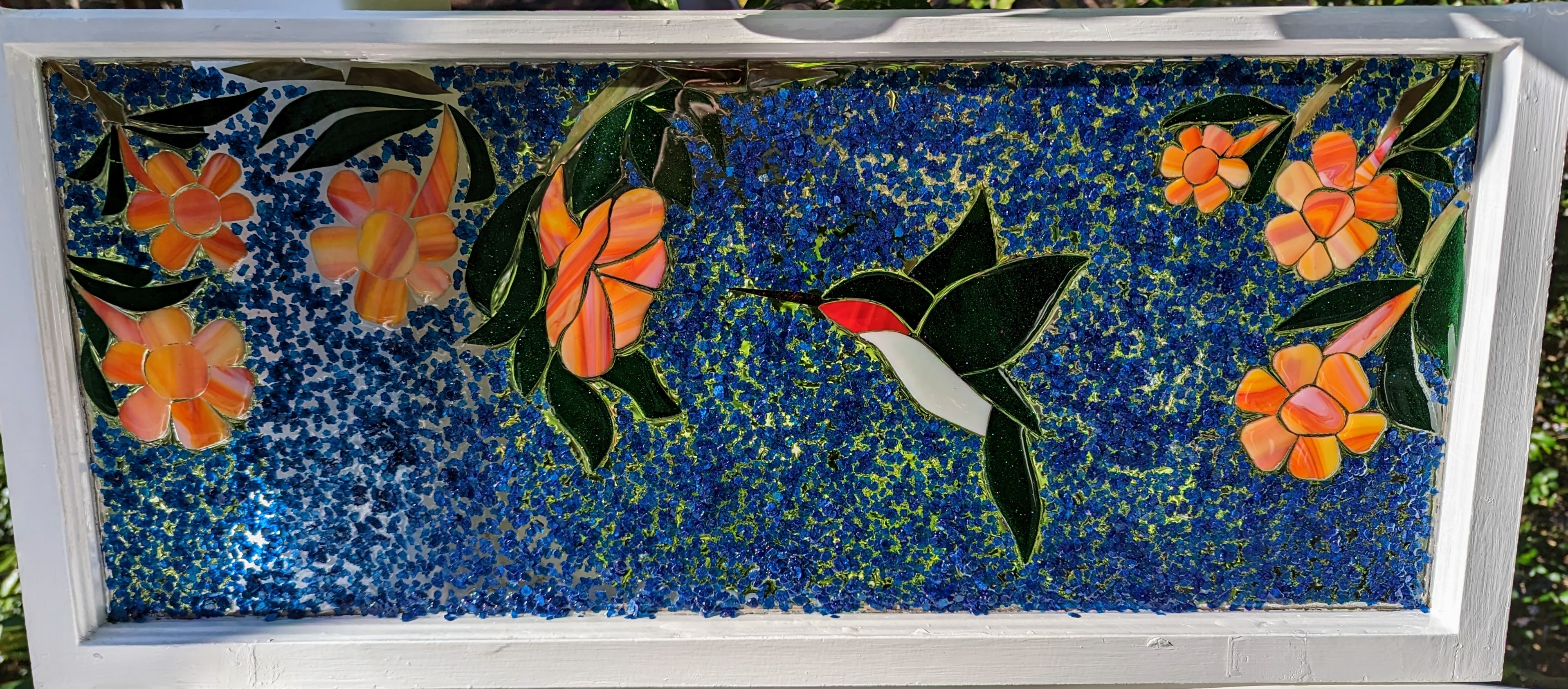 Hummingbird and trumpet vine, stained glass and mica in resin in recycled window